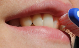 person cleaning teeth